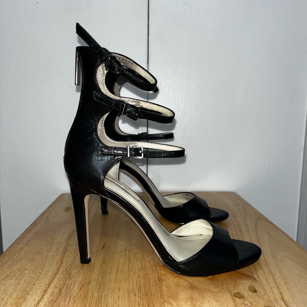 BCBG black peep toe high heel with zippers in the back to close.